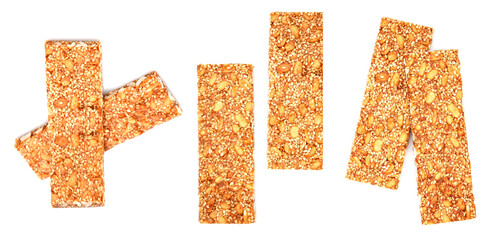 The image shows several rectangular granola bars scattered against a white background. The bars have a textured, grainy appearance.