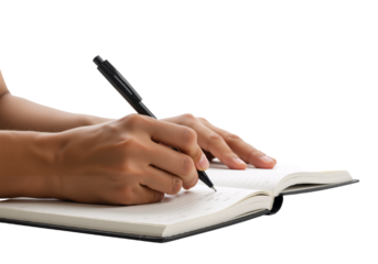 Close-up of a person's hand writing in a notebook, capturing the act of note-taking and journaling