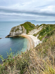 Man O'War Beach on Jurassic Coast, Dorset, England, UK. Scenic bay surrounded by Jurassic Coast rocks. Sunny summer days. beautiful landscape and seascape view. English Channel sea view. Cliffs, rocks