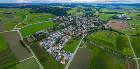 Aerial view of the village Esenhausen in Germany on a cloudy day in summer