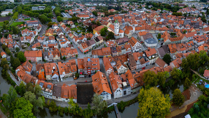 Aerial view around the old town of the city Wangen im Allgäu in Germany on am overcast afternoon in summer.	