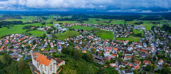 Aerial view of the village Waldburg in Germany on a cloudy afternoon in summer