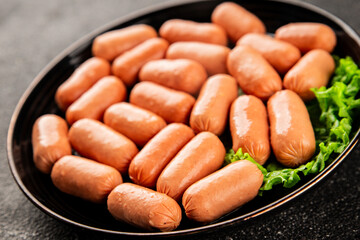 Mini sausages fresh delicious processed meat tasty snack fresh delicious gourmet food background on the table rustic food top view copy space
