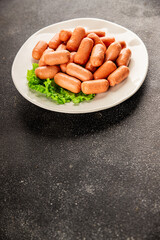 Mini sausages fresh delicious processed meat tasty snack fresh delicious gourmet food background on the table rustic food top view copy space