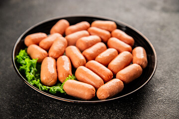 Mini sausages fresh delicious processed meat tasty snack fresh delicious gourmet food background on the table rustic food top view copy space