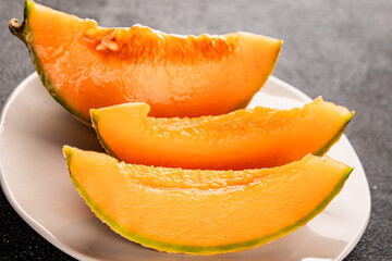 Melon Charente ripe sweet fruit tasty snack fresh delicious gourmet food background on the table rustic top view copy space keto and paleo diet vegan and vegetarian food