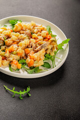 Potato salad with smoked fish tasty snack fresh delicious gourmet food background on the table rustic food top view copy space