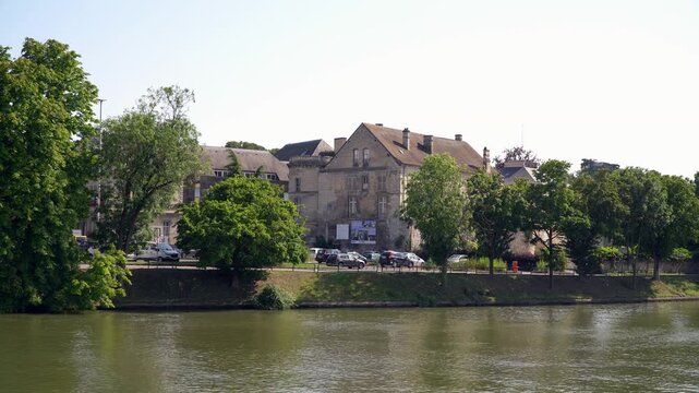 The Oise river flowing through the city of Creil, France
