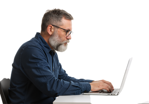 Professional bearded man with glasses diligently engaged in typing on a laptop, showcasing focused work or online activity with concentration