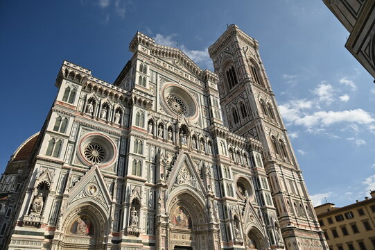 Front Facade Of The Cathedral Of Florence Italy On A Wonderful Sunny Autumn Day With A Few Clouds In The Sky