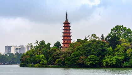 Hanoi's Tran Quoc Pagoda Rising from Lush Greenery Overlooking the Waterscape