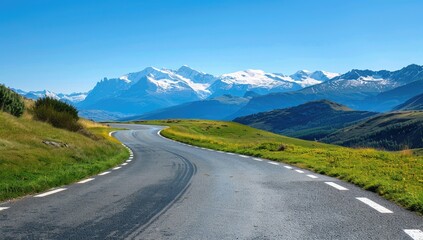 Fototapeta premium Mountain road winding through alpine pasture, snow-capped peaks backdrop; travel, adventure