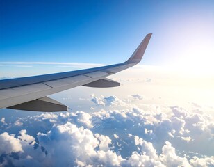Fototapeta premium High-altitude view of airplane wing and clouds