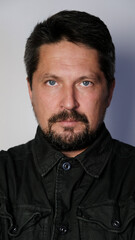 portrait of a Slavic Russian man with blue eyes and beard