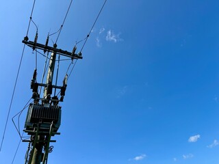 power transformer mounted on an electrical pole, efficiently distributing electricity by reducing 