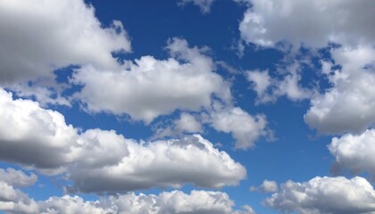 Fototapeta premium Fluffy clouds in a vast blue sky