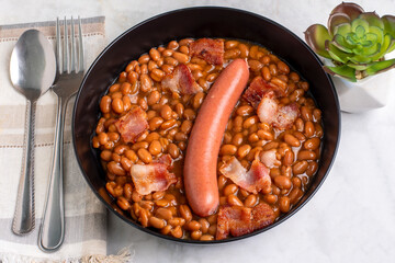 baked beans  with hot dog and  bacon