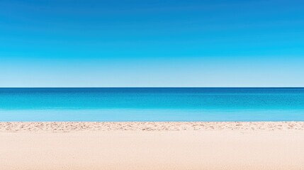 Fototapeta premium A tranquil beach scene under a vibrant blue sky.