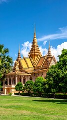 Fototapeta premium Golden temple in a lush garden under a vibrant blue sky