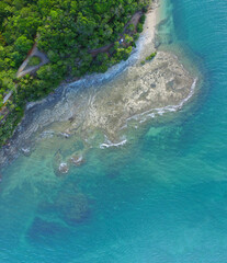 Large reef on the coast of the island, Coast as a background from top view. Turquoise water background from top view