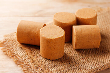 Brazilian peanut candy, traditionally known as pacoca or pacoquinha, on a wooden table