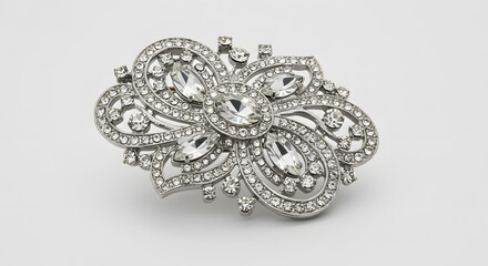 Obraz premium Elegant Crystal Brooch on a White Background Showcasing Intricate Detailing and Shimmering Stones for Fashion Accessories and Jewelry Collections Promotion.