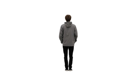 A person standing with their back to the camera wearing a gray hoodie and black pants on black background