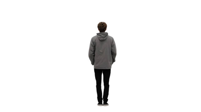 A person standing with their back to the camera wearing a gray hoodie and black pants on black background