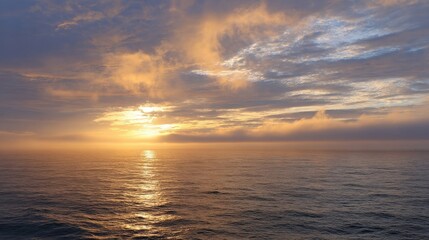 Obraz premium Golden Hour Sunset Over Calm Ocean