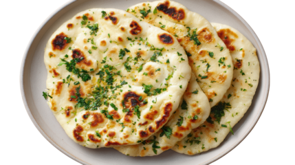 Freshly baked naan bread with herbs on a plate, ready to serve.