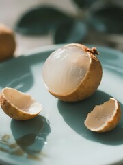 Lychee Fruit Served on a Plate, Partially Peeled to Reveal White Flesh