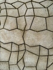 Natural stone pavement with irregular geometric shapes and textured surface