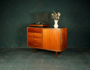 vintage wooden furniture and accessories on dark background