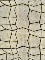 Natural stone pavement with irregular geometric shapes and textured surface