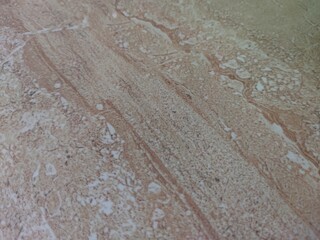 marble surface texture with light brown and cream colored streak patterns