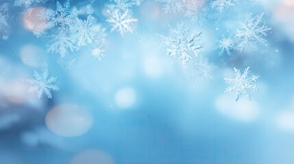 Naklejka premium Delicate snowflakes against a soft blue background.