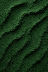Rolling Emerald Hills: The scene captures a close-up of undulating green textures, resembling a landscape of rolling hills or textured terrain, offering a sense of natural beauty and visual intrigue.