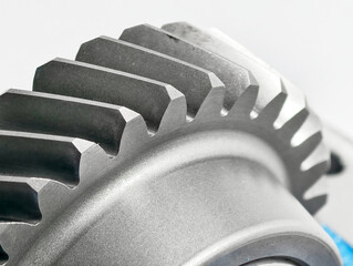 Close-up view of a metallic gear showcasing precise teeth structure and engineering craftsmanship