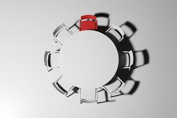 Round boardroom table with one red leader chair, leadership, decision making, teamwork, corporate meeting.