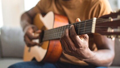 Fototapeta premium Close-up of a person playing an acoustic guitar