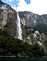 Majestic waterfall cascading down rocky mountains