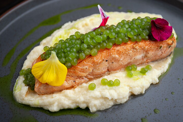 Salmon Fillet with Protein Caviar, Puree and Edible Flowers