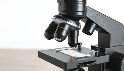 Close-up view of a modern microscope, showcasing its detailed components and precise mechanisms.