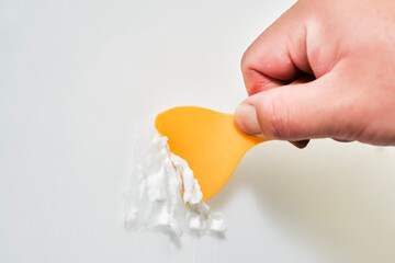 Use tools to clean the adhesive