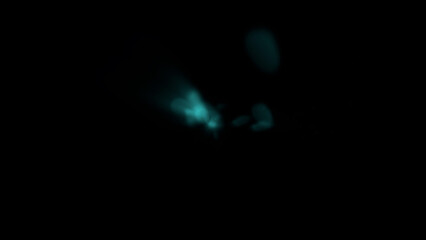 Mysterious glowing ethereal particles drift in dark abstract space, creating a mystical ambiance