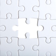 White puzzle pieces with one missing