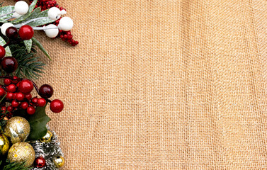 Abstract elegant Christmas festive decoration with red berries, a pinecone, and frosty pine needles background. 