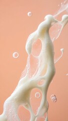Fototapeta premium Abstract white foam splash with air bubbles on peach background