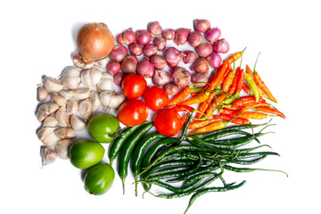 Various raw spices for cooking ingredients on white background; onion, garlic, chili, tomato