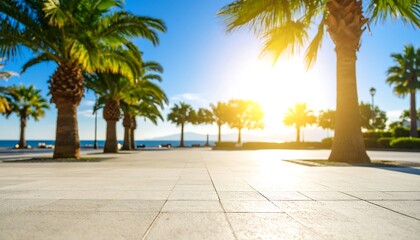 Fototapeta premium A sunny coastal walkway lined with palm trees, leading to a serene ocean view, bathed in golden sunlight.
